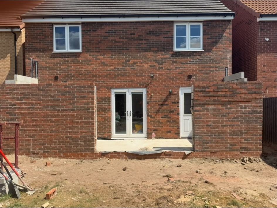 Rear extension or boundary brick walls under construction